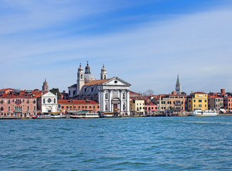 Fototapeta na wymiar a view of venice from the sea showing the zattere salute area with the church of santa maria del rosario and waterfront landmark buildings