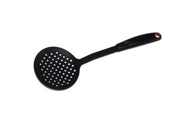 ladle, spatula and skimmer from food plastic in black on a white background, isolate, kitchen utensils