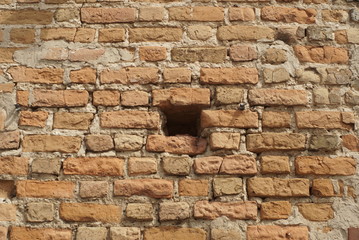 hole in the brick wall
