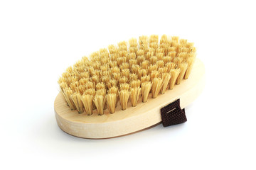 massage wooden soft body brush with a natural nap, is worn on the arm, on a white background, used in the shower for washing the body