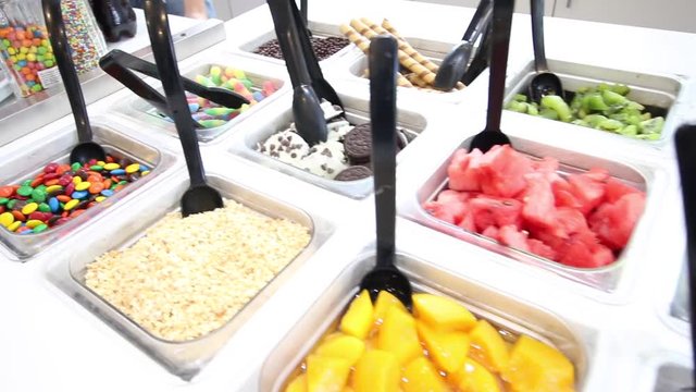 fruit, candy and cookies toppings on shop