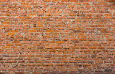 Old wall of rough red brick. Brickwork. Grunge background.	