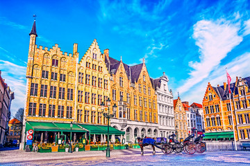 Fototapeta premium Colorful old brick house on the Grote Markt square in the medieval town of Bruges, Belgium