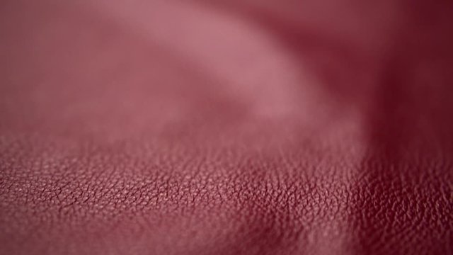 Red color leather. Red suede Genuine leather industry in Italy. Made in Italy. Finishing materials for gadgets. Texture genuine leather - end, background. Dolly
