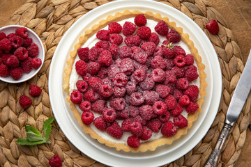 raspberry tart  on wooden table