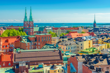 Aerial panorama of Helsinki. Cityscape of the Capital of Finland with Baltic Sea in the background. Colorful houses in the traditional Scandinavian architecture style