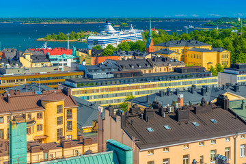 Cityscape of Helsinki, Finland. Colorful houses of the biggest Finnish city. Panorama with a Cruise liner and The Baltic Sea with numerous Islands