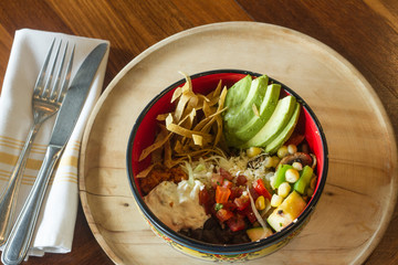 Mexican food: Bowl of avocado, and tomato salad.