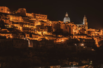 Fototapeta na wymiar Night experience in old baroque sicilian town Ragusa in Sicily, south Italy