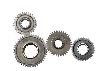 Interlocking metal gears isolated on a white background. Cogwheel industrial background.