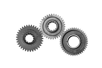 Interlocking metal gears isolated on a white background. Cogwheel industrial background.