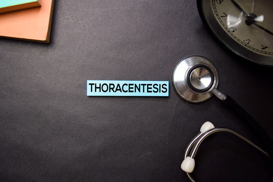 Thoracentesis text on Sticky Notes. Top view isolated on black background. Healthcare/Medical concept