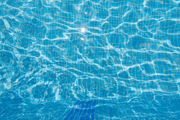 ripples reflections on clear water in a swimming pool