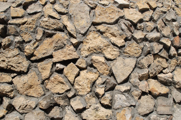 Wall texture of natural stone fragments.