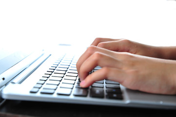 Close-up of typing female hands on keyboard