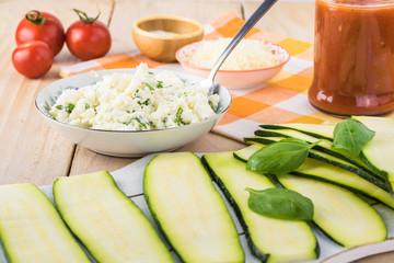 Zucchini rollups with cheese in marinara sauce.