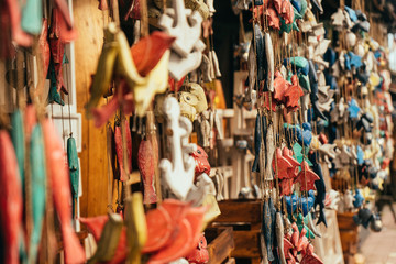 Fototapeta premium Handmade wooden mobile souvenirs hanging in Bali shop