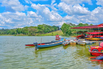 Fototapeta na wymiar Boat on the lake with green nature background