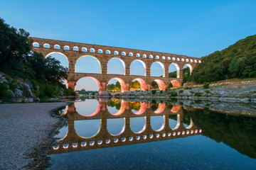 Pont du Gard Roman aqueduct over Gard River at dusk, Gard Department, Languedoc-Roussillon, France