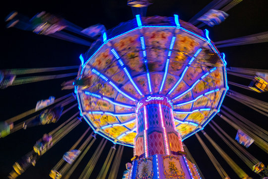 Chair Swing ride at Hamburger DOM funfair at night, St. Pauli, Hamburg, Germany