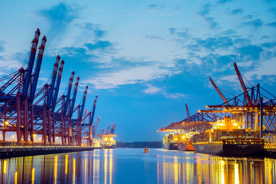 Cargo ships being loaded at Burchardkai in Hamburg Harbor at night, Waltershofer Hafen, Hamburg, Germany