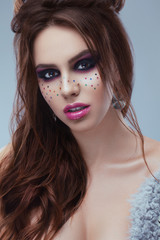 Portrait Of Female Model With Creative Makeup. Close-up image of great beauty art make-up. Beauty. Beautiful Woman Face With soft color Lipstick. Sexy Full Lips. Cosmetics and Skincare concept