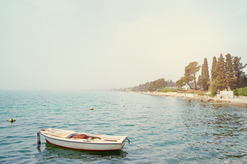 Beautiful landscape with seashore and fishing boat.