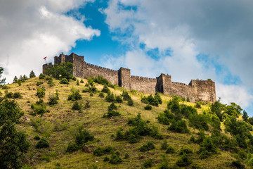 Fototapeta na wymiar Ruins of medieval fortress Maglic on top of hill by the Ibar river in Serbia. Valley of this river is also called Lilac valley.