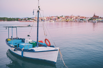 Beautiful landscape with seashore and wooden fishing boat.