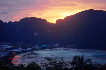 Wonderful sunset on Phi Phi Don island view point. Beautiful landscape with tropical sea lagoon.