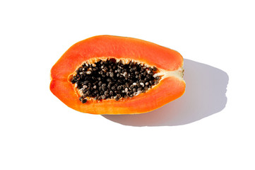 Fresh papaya exotic tropical fruit on white background. Sun day light illumination. Minimalistic...