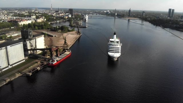 4k aerial view of floating cruise liner Isabelle on river Daguava, Riga