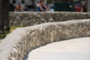 Miami Beach Ocean Drive coral rock wall. Shallow depth of focus and blurry bokeh