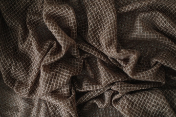 Fabric texture background. Wrinkled, crumpled fabric. Closeup textile background. Knitted texture pattern.  Soft focus