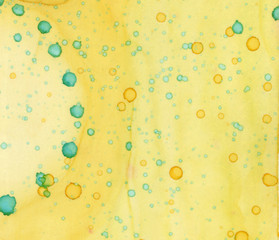 Honey Yellow Alcohol Ink Abstract Painting Background with Green Ink Splatters, Drops and Dots