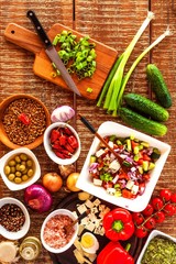 Preparation of vegetable salad with cheese. Diet healthy food. Summer salad with tomato and pepper. Vegetarian food.