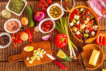 Preparation of vegetable salad with cheese. Diet healthy food. Summer salad with tomato and pepper. Vegetarian food.