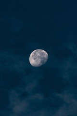 The moon in a cloudy sky