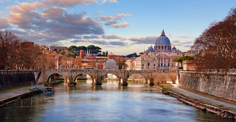 Dome Saint Peters Basilica Vatican City. Cityscape Panoramic. View Old bridge evening sunset with sky and pink clouds. Autumn landscape.