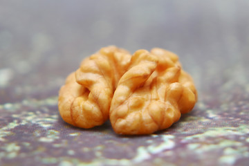 Walnuts on the background imitating the old peeling paint.