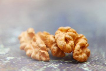 Walnuts on the background imitating the old peeling paint.