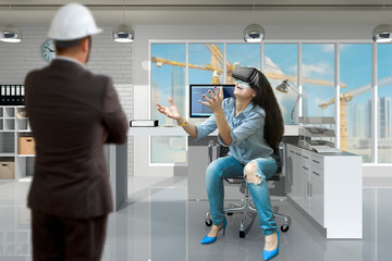 The boss looks at the girl in the virtual reality headset