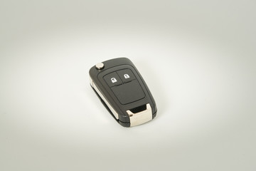 Car key on a white background. Perfect symbol to acquire a vehicle, to have property etc.