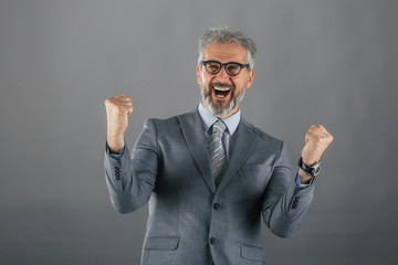 businessman shouting isolated on gray background