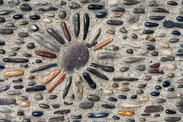 Street surface with different shaped stones in historic hilltop village near Nice in France.
