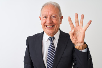 Senior grey-haired businessman wearing suit standing over isolated white background showing and pointing up with fingers number four while smiling confident and happy.