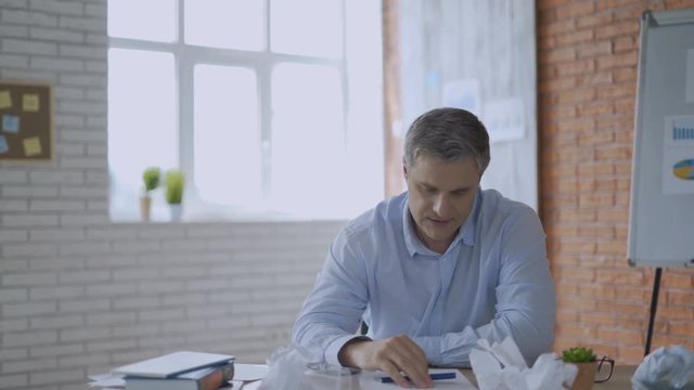 Tired businessman having headache in the office 4K