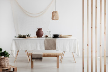 Fototapeta na wymiar White and beige dining room in rustic home