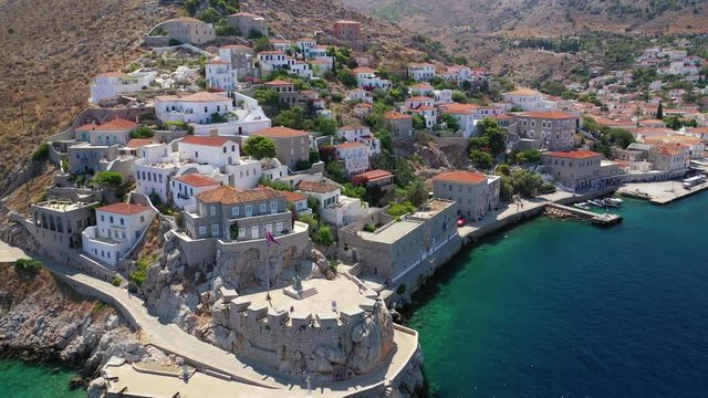Aerial drone video of picturesque port and main village of Hydra or Ydra island with beautiful neoclassic houses, Saronic gulf, Greece