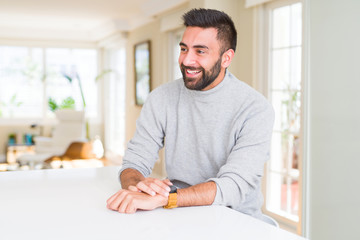 Handsome man smiling cheerful with a big smile on face showing teeth, positive and happy expression